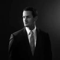 Andrew J Karian
