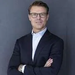 Rolf Adam, Group CEO at Implico